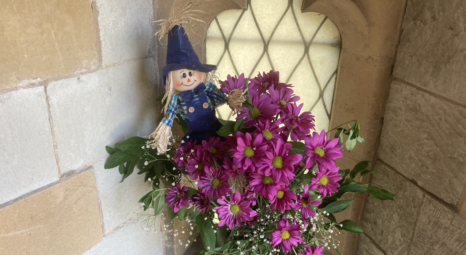 Hidden behind the flowers, another scarecrow waits to pounch.